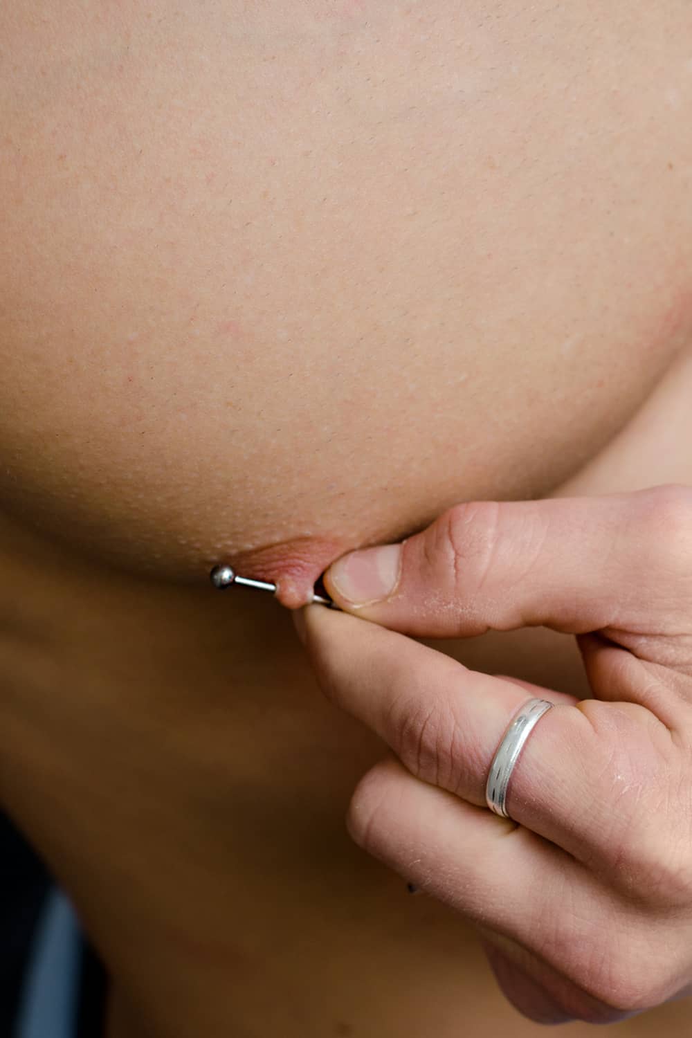 How to safely change your nipple ring